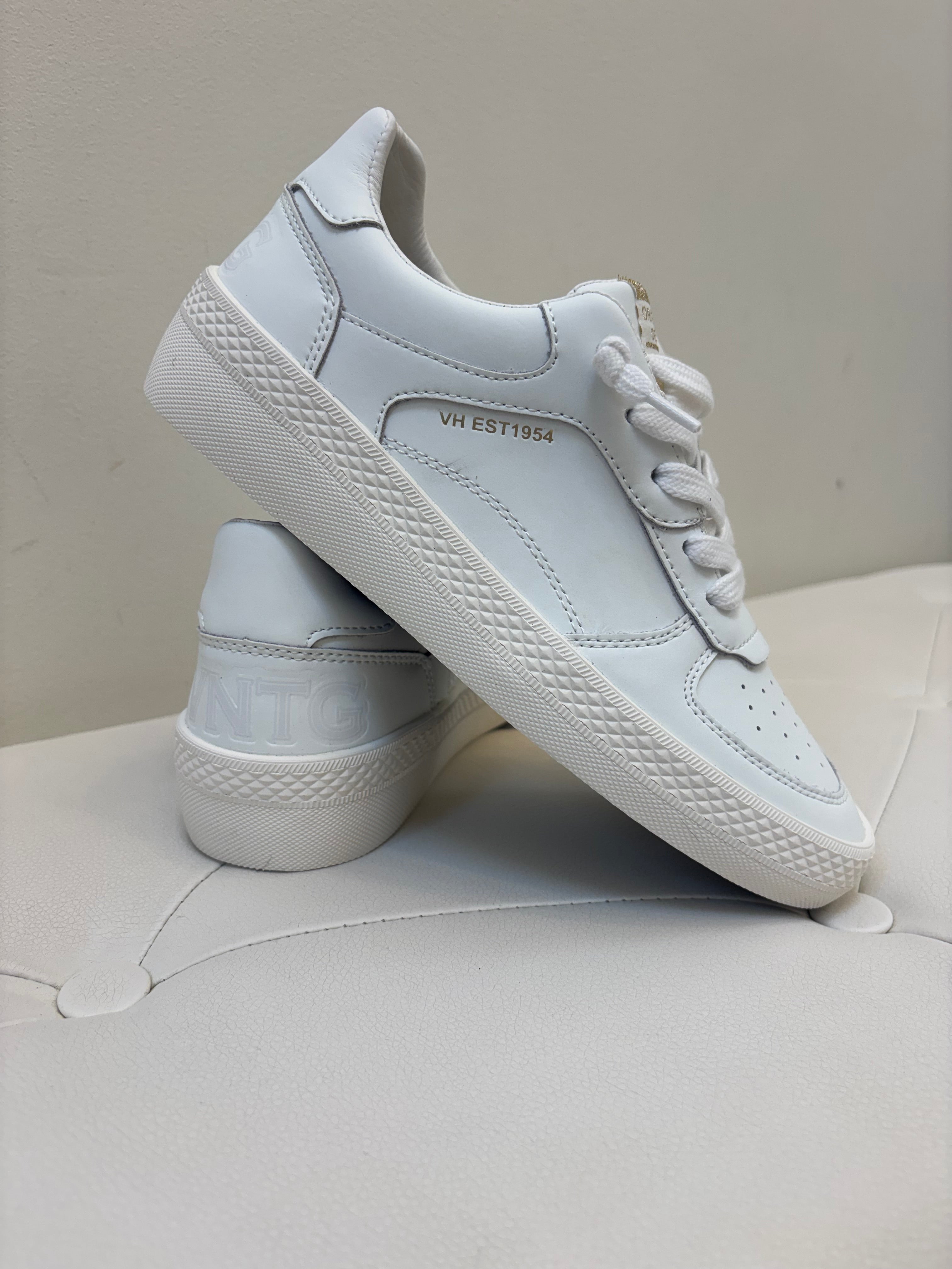 White sneakers on a white surface